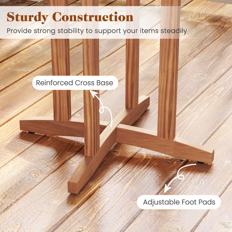 Close-up of the reinforced cross base and adjustable foot pads of the 39-inch acacia wood bar table for outdoor use.