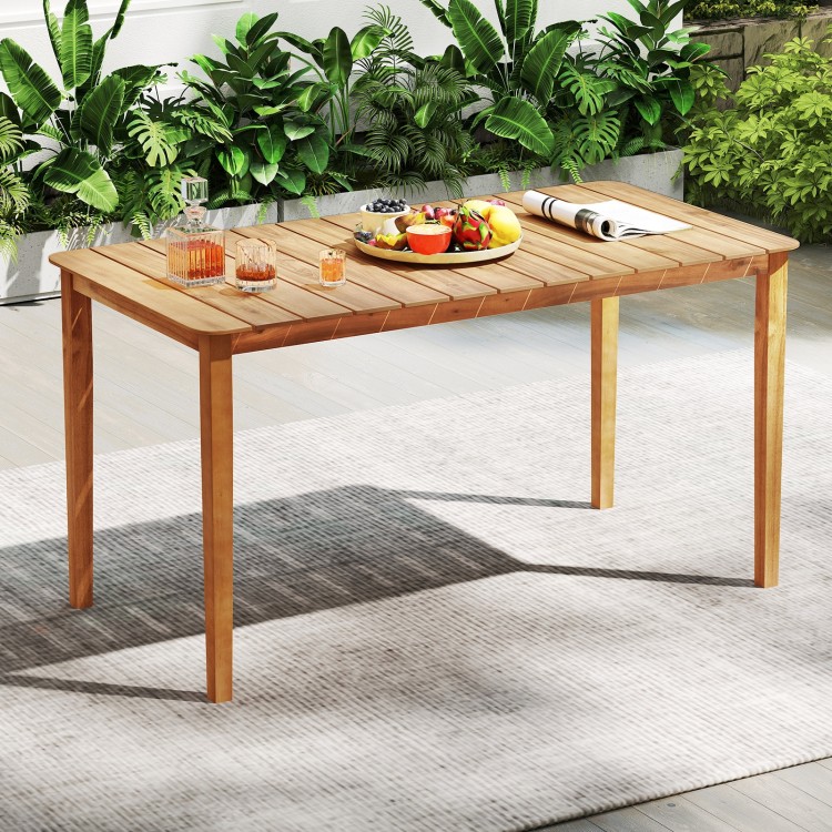 Rectangular outdoor dining table made of acacia wood, seating 4-6 people, with a slatted top for easy cleaning.