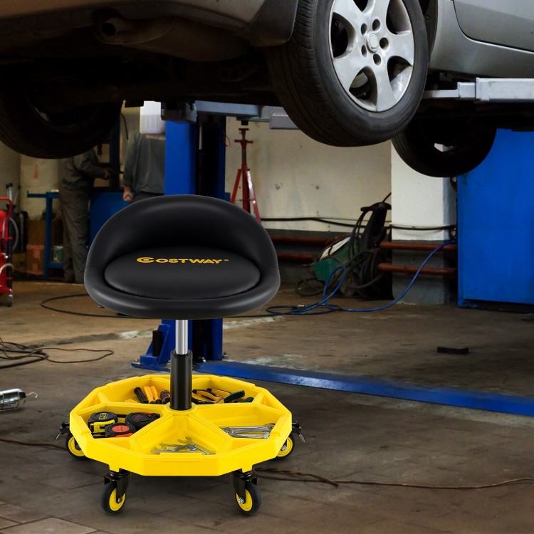 Height adjustable yellow rolling garage stool with tool tray storage, padded seat, and 5 wheels for easy mobility.