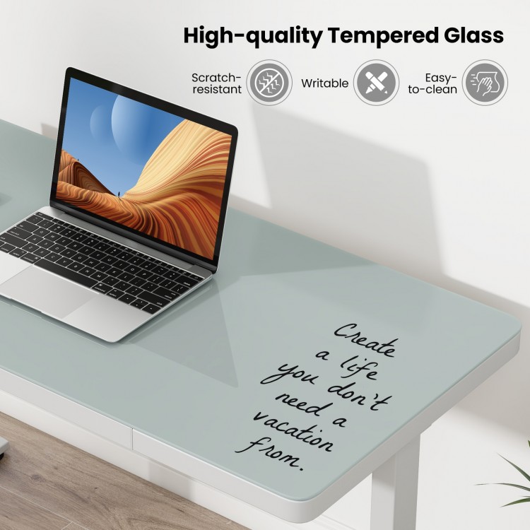 Height adjustable electric standing desk with writable tempered glass top, featuring a practical storage drawer for.