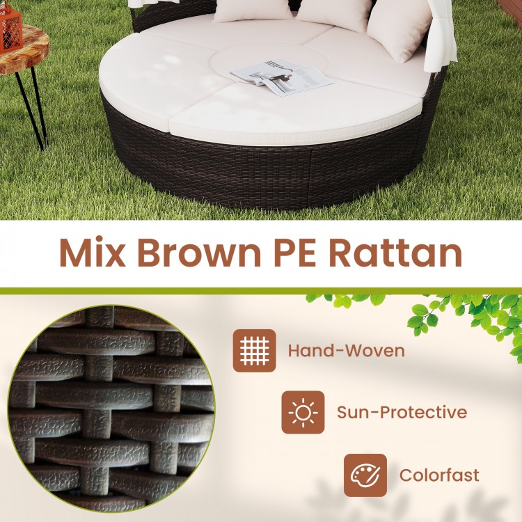 Round patio daybed in mix brown PE rattan with retractable canopy and cushions, ideal for outdoor relaxation.