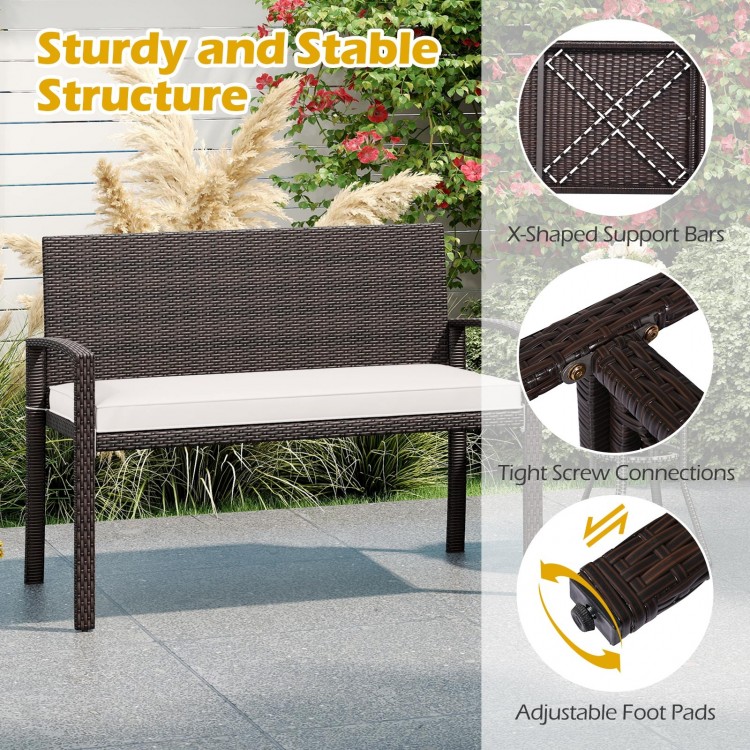 Wicker 2-seat bench with soft cushion, sturdy metal frame, ideal for outdoor patios and gardens.