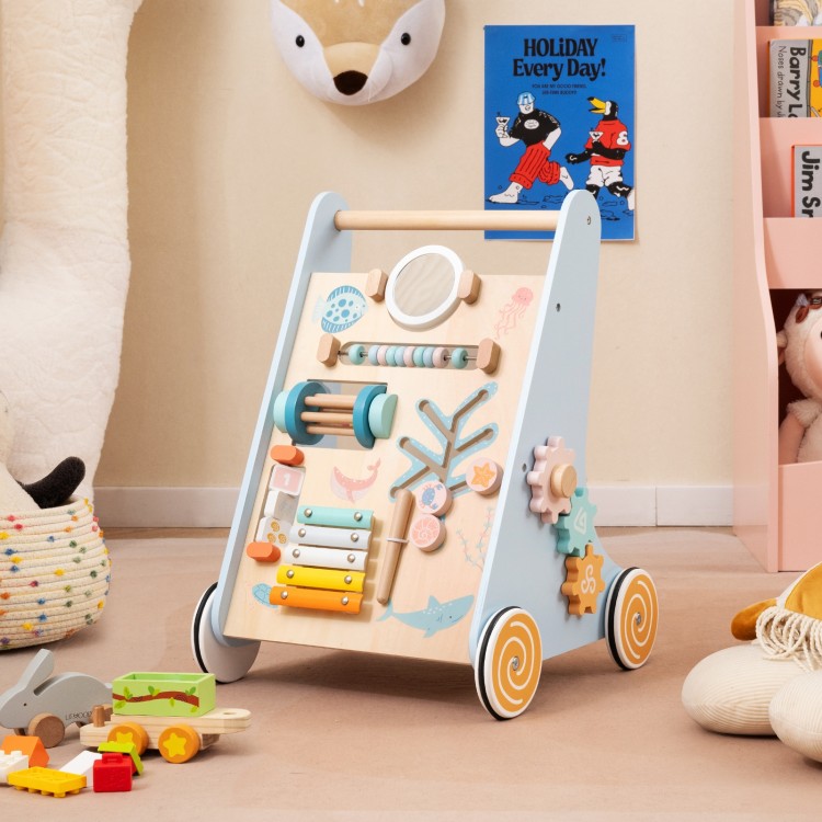 Wooden baby walker activity center in blue with wheels, featuring a mirror, xylophone, and shape sorters for learning.