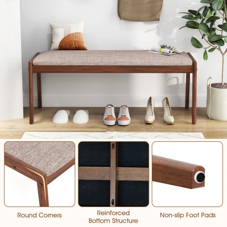 Farmhouse backless bench with rubber wood legs, beige padded seat, and non-slip foot pads for entryway or dining room.