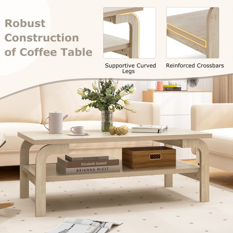 Accent rectangular coffee table with supportive curved legs and open shelves, perfect for living room gatherings.