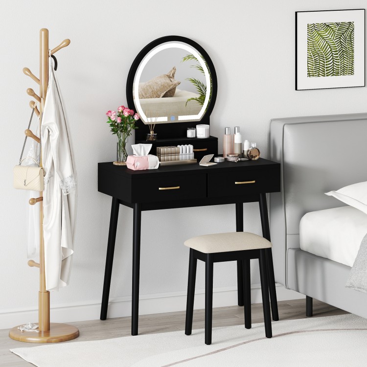 Small black vanity makeup dressing table set with cushioned stool and LED lighted mirror, perfect for compact bedrooms.
