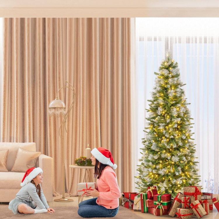 Pencil-shaped 6 FT artificial Christmas tree with warm-white LED lights, surrounded by festive gifts in a cozy living.