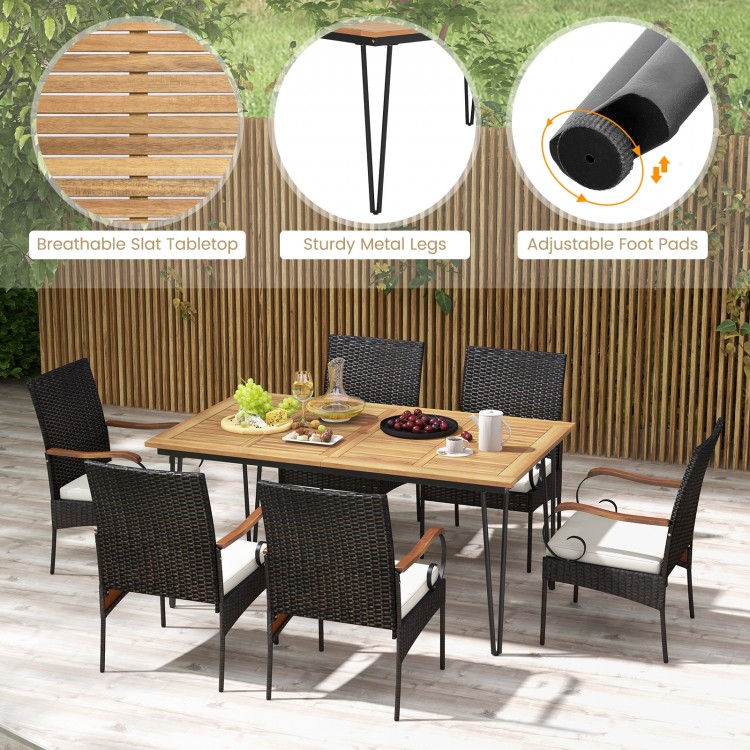 7-piece patio dining set featuring a slatted acacia wood tabletop and rattan armchairs with soft cushions for outdoor.