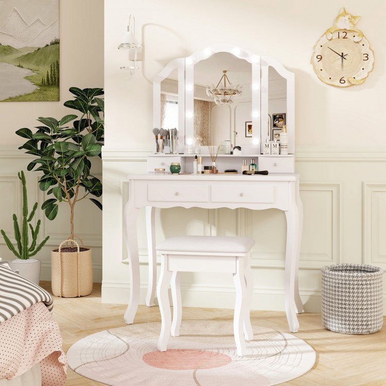 Makeup vanity table set in white with tri-folding mirror, cushioned stool, and ample storage for beauty essentials.