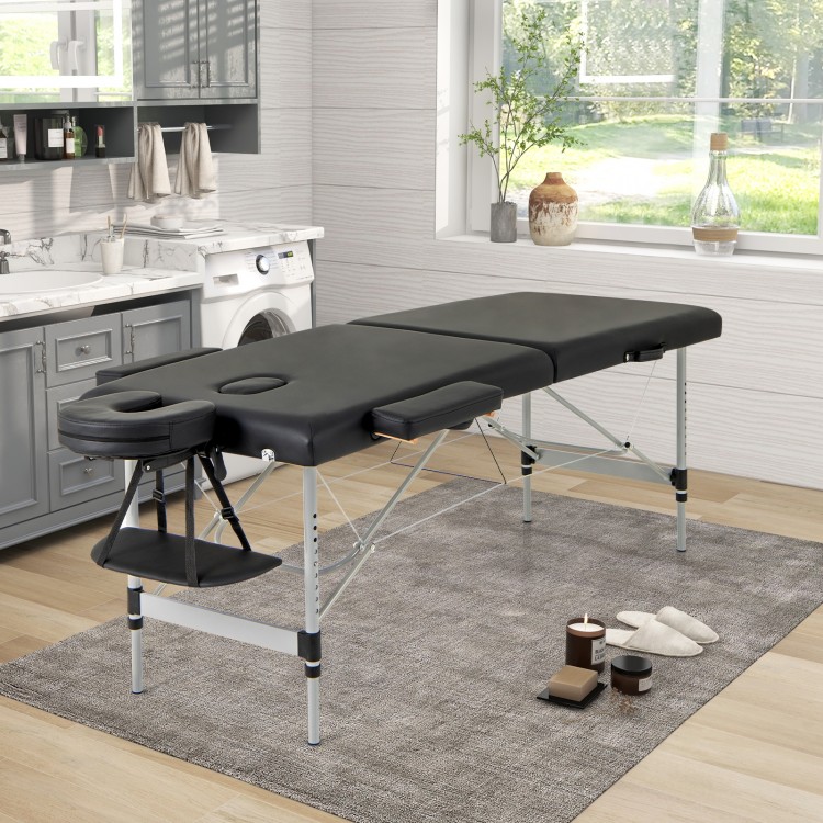 Professional 84-inch black massage bed with adjustable headrest and side armrests, ideal for comfort and portability.
