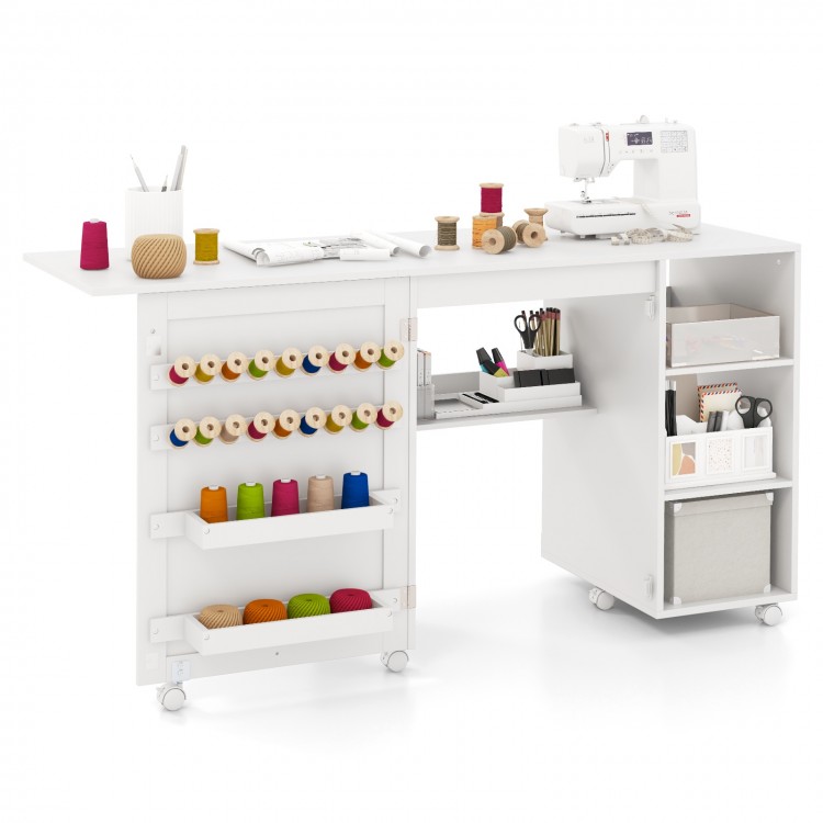Multifunctional folding sewing machine craft station in white with ample workspace, storage shelves, and thread racks.