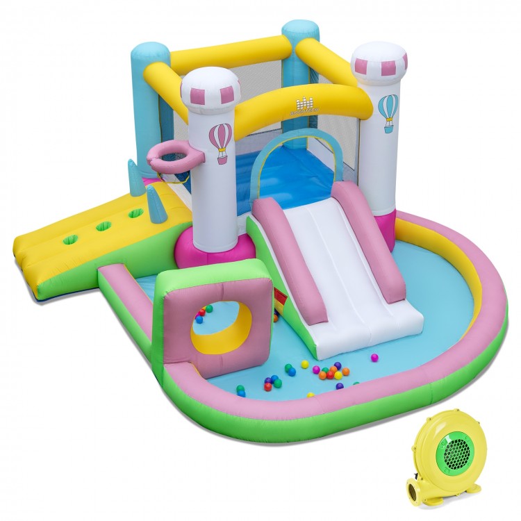Colorful inflatable bounce house with slide, basketball hoop, and ball pit for outdoor fun and parties.