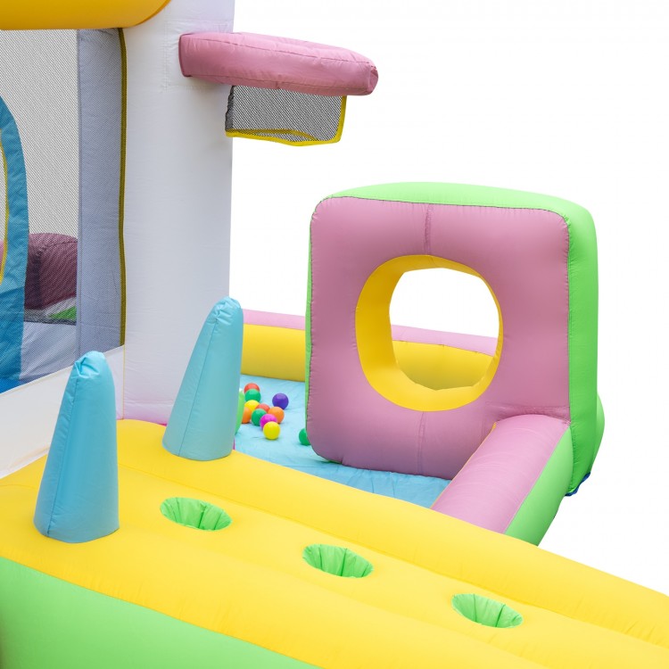 Colorful inflatable bounce house with slide, ball pit, and basketball hoop, perfect for outdoor fun and birthday.