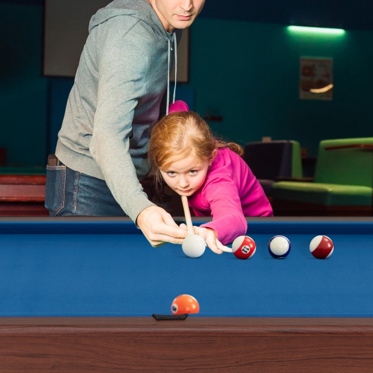 Child aiming at a blue 48-inch pool table with a full set of balls, promoting family fun and interaction.
