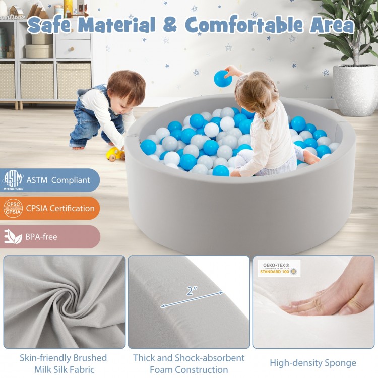 Soft gray kiddie playpen with 200 ocean balls, featuring a removable cover and thick foam for safe, comfortable play.