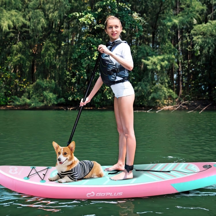 Inflatable stand-up paddle board with a dog onboard, featuring a pink design and anti-slip EVA pad for stability.