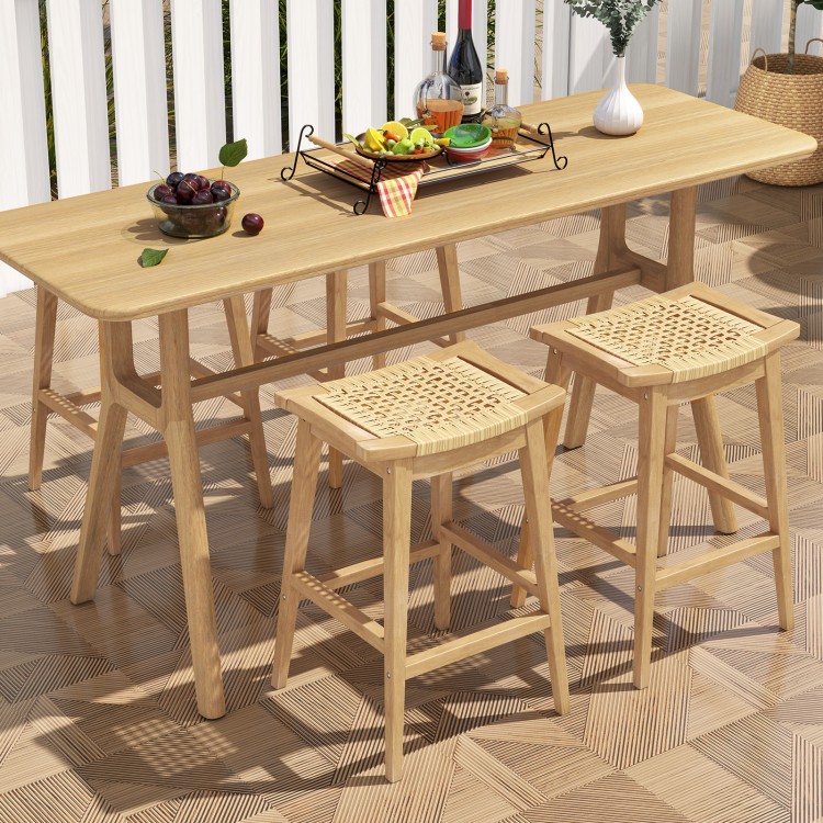 Patio barstool with saddle seat and footrest, crafted from Indonesian teak wood and hand-woven PE rattan for comfort.