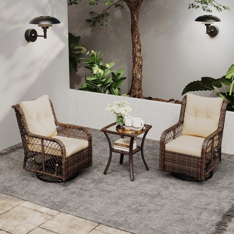 Patio furniture set featuring two brown PE wicker swivel glider chairs and a 2-tier side table, perfect for outdoor.