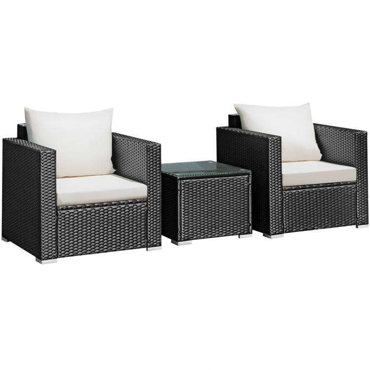 Two black wicker armchairs with white cushions and a glass-top coffee table, perfect for outdoor patio relaxation.