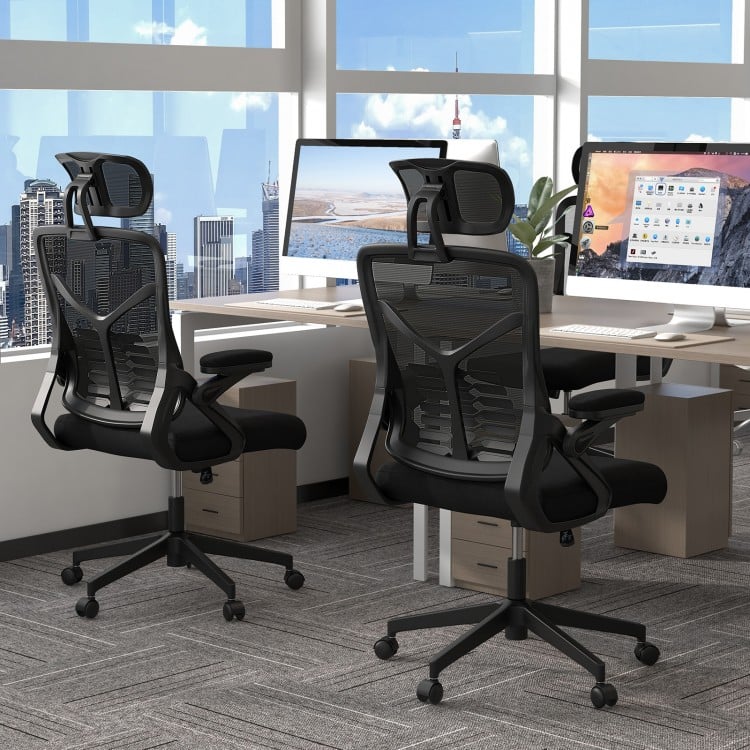 Ergonomic mesh office chair with lumbar support, adjustable headrest, and armrests, designed for comfort in a modern.