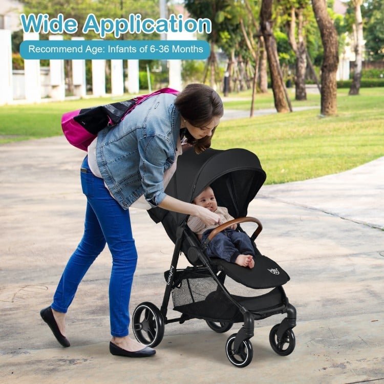 Lightweight black infant stroller with adjustable backrest, 5-point harness, and detachable foot cover for infants 6-36.