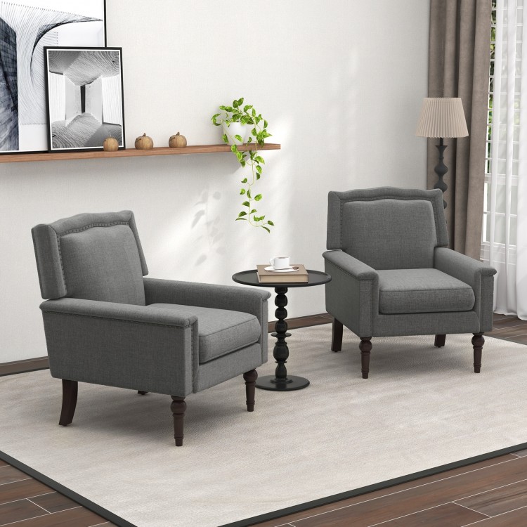 Gray mid-century modern armchair with cushion and nailhead trim, perfect for living rooms or offices.