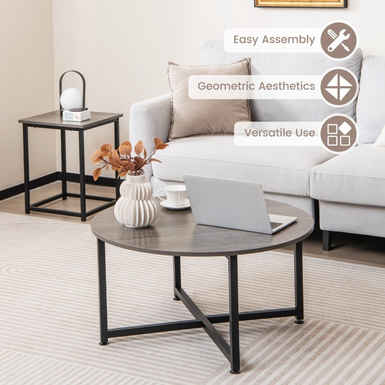 Round coffee table with gray tabletop and black metal frame, part of a 3-piece set for versatile living room use.