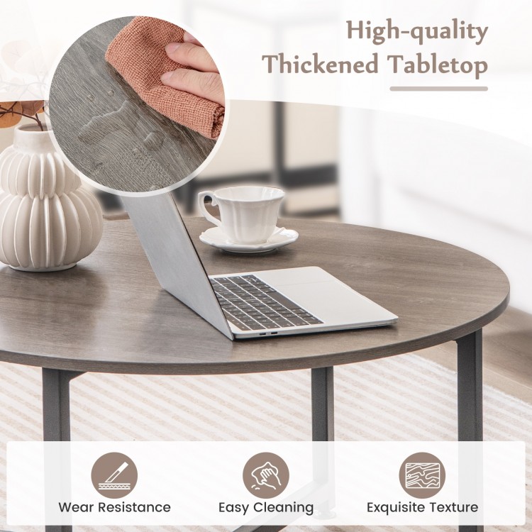 Round coffee table with gray thickened tabletop, showcasing easy cleaning and exquisite texture for versatile layouts.