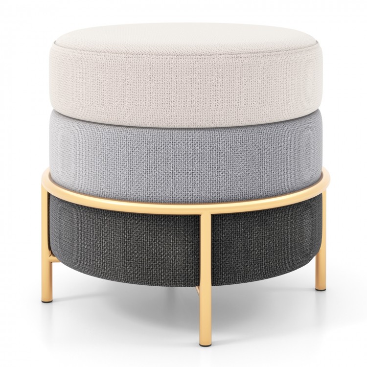 Round upholstered ottoman in beige, light gray, and dark gray with gold metal legs, ideal for living room or bedroom.