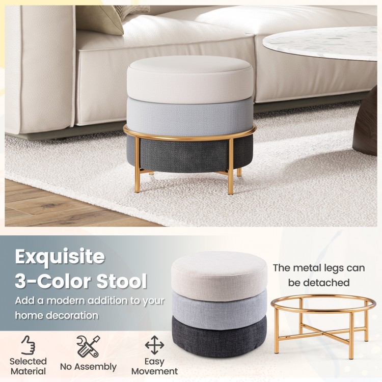 Three-color upholstered ottoman featuring a gold metal base, perfect for a stylish accent in any room.