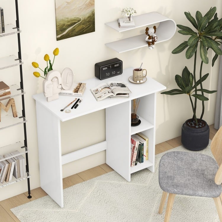 Small white computer desk with adjustable shelf and storage, ideal for space-saving in small apartments.
