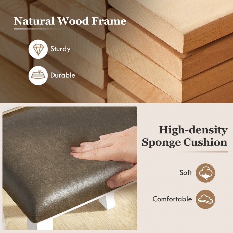 Gray faux leather cushion of a vanity stool, featuring a sturdy natural wood frame, ideal for makeup rooms and living.