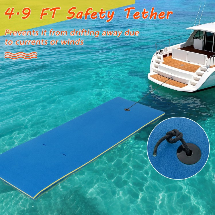 Blue 7' x 2' water mat with 4.9 ft safety tether, designed for lakes and pools, featuring a pillow for added comfort.