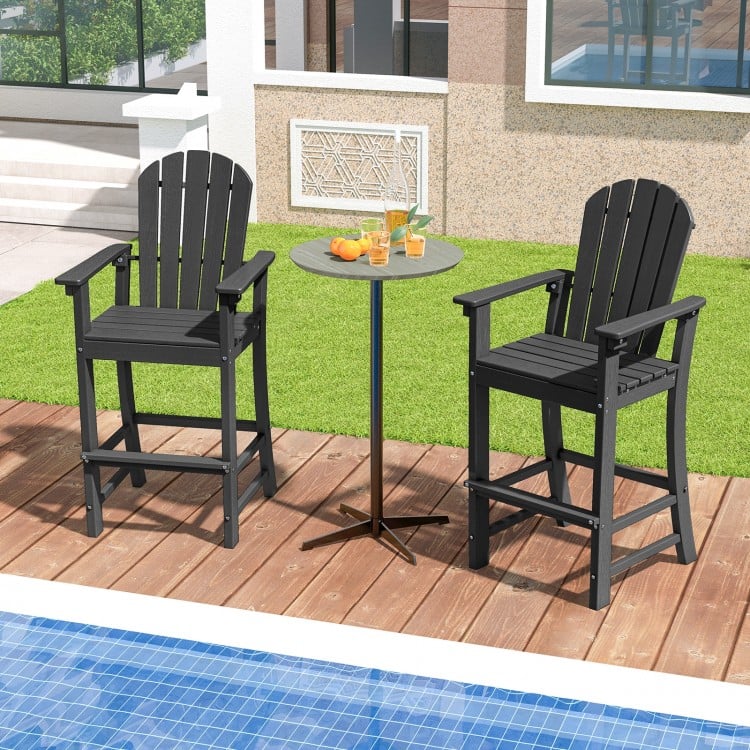 Set of 2 black HDPE outdoor bar stools with armrests and footrest, perfect for counter height tables by the pool.