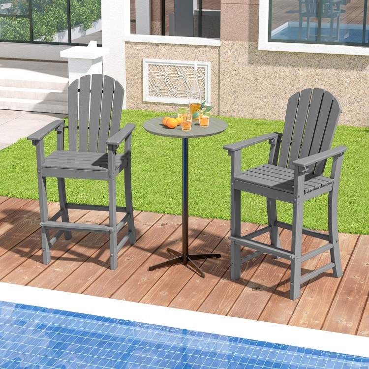 Counter height gray HDPE bar stools with armrests and footrest, perfect for outdoor relaxation by the pool.