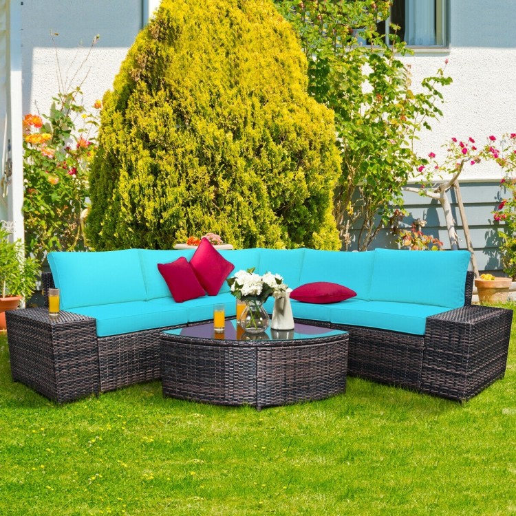 Cushioned 6-piece turquoise rattan sofa set with glass table, perfect for backyard relaxation and outdoor gatherings.