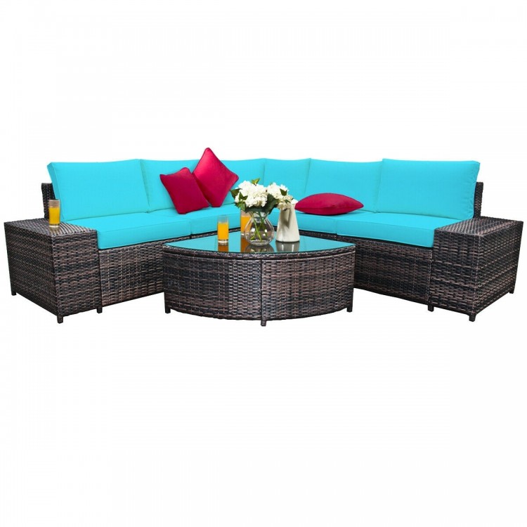 Cushioned 6-piece rattan sofa set in turquoise with glass table, perfect for outdoor relaxation and gatherings.