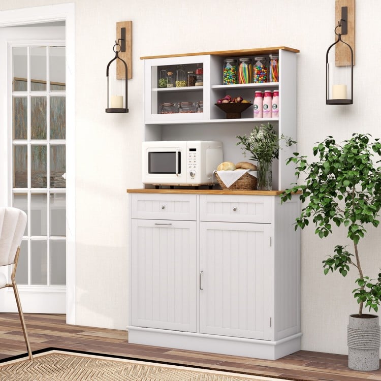 Double tilt-out trash cabinet with hutch, rubberwood countertop, and glass doors for organized kitchen storage.