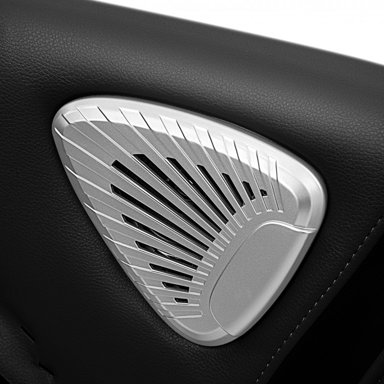 Close-up of the silver loudspeaker cover on the black Massage Chair Capsule, featuring a sleek design for elegant.