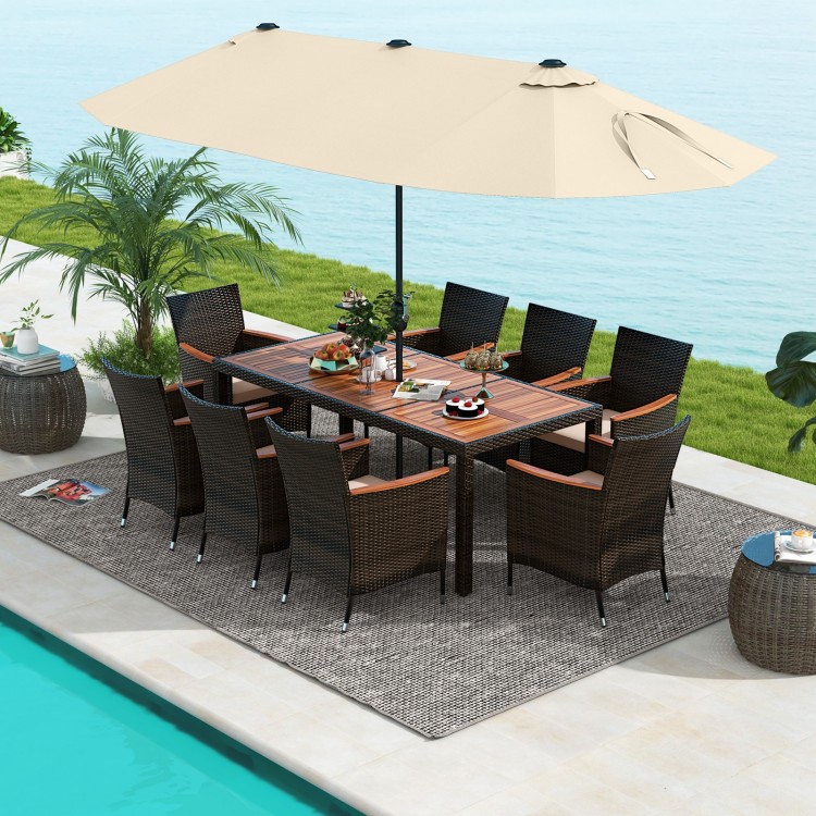 10-piece outdoor dining set featuring a rattan surface, acacia wood tabletop, and a large beige patio umbrella for.