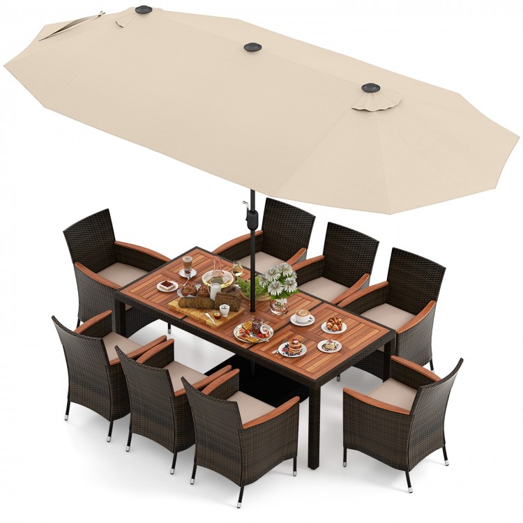 10-piece outdoor dining set featuring a large acacia wood table, rattan chairs, and a double-sided beige patio umbrella.