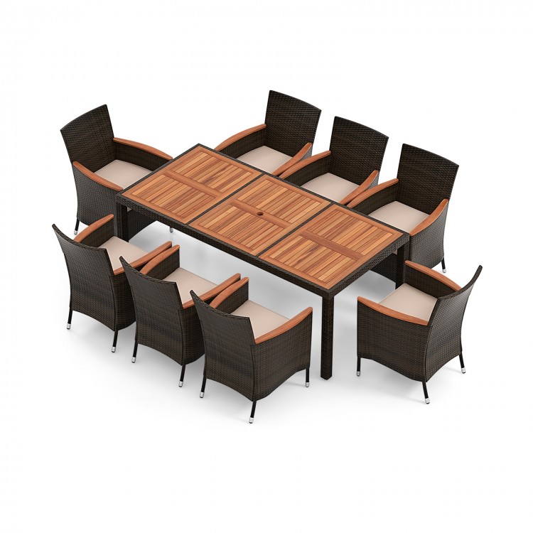 10-piece outdoor dining set featuring acacia wood tabletop, rattan chairs with cushions, and a large patio umbrella for.