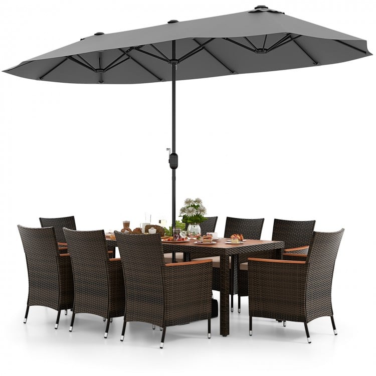 10-piece outdoor dining set featuring a gray double-sided patio umbrella and elegant rattan chairs for backyard.