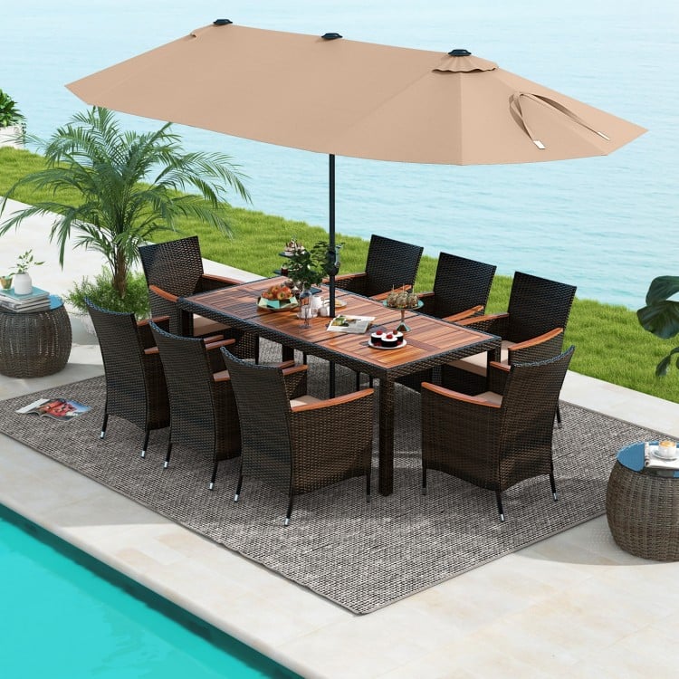 10-piece outdoor dining set featuring a brown rattan design, acacia wood tabletop, and a large double-sided umbrella.