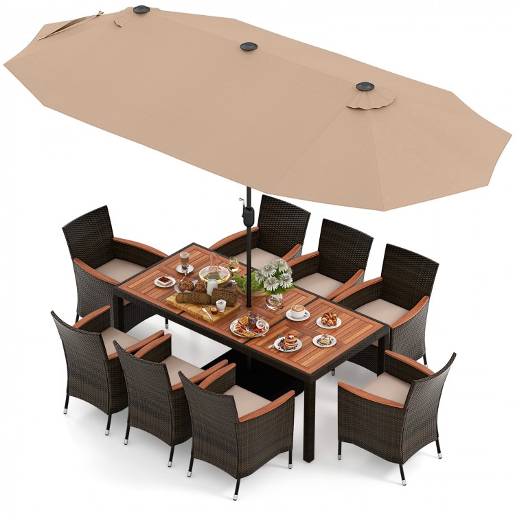 10-piece outdoor dining set featuring a brown rattan surface, acacia wood tabletop, and a large double-sided umbrella.
