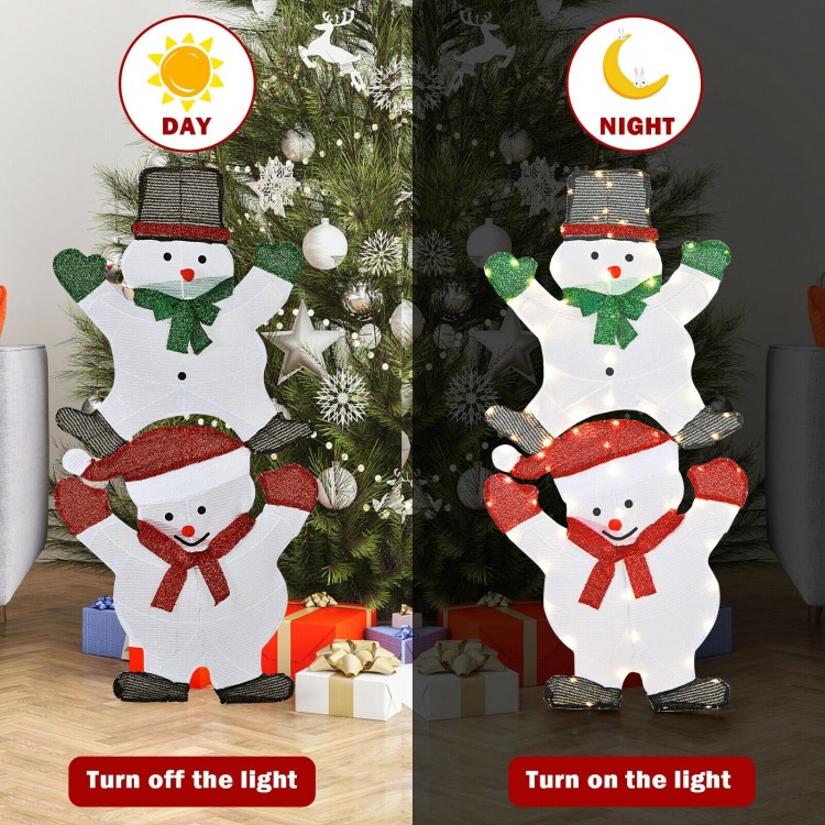 Three stacked snowmen Christmas decorations, 54 inches tall, with bright lights, perfect for outdoor holiday displays.