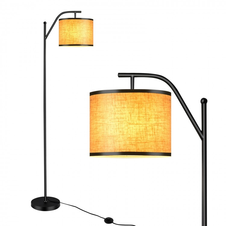 Standing floor lamp with adjustable head, matte black iron frame, and beige fabric shade for living room or bedroom use.