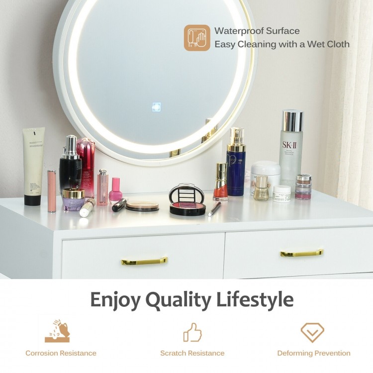 Vanity dressing table set with rounded mirror, golden handles, and LED lights for modern bedroom decor and makeup.