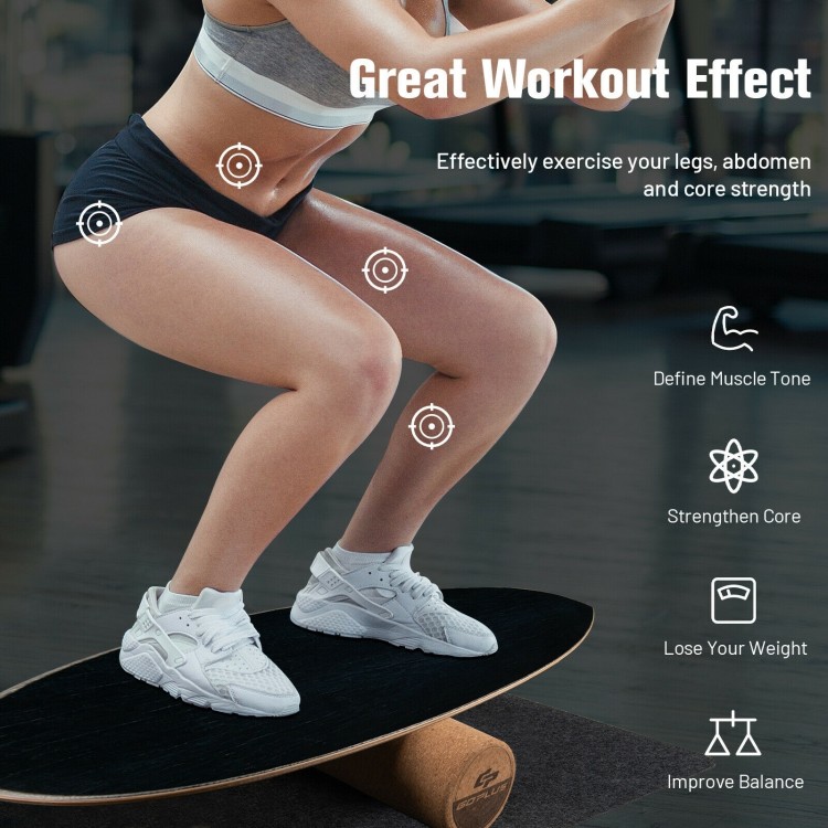 Wooden balance board trainer in black, made of birch and cork wood, ideal for core strength and balance exercises.