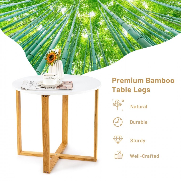 Multifunctional round side table with bamboo legs and X-shaped base, ideal for living room or bedroom storage.